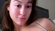 Busty babe playing with her big boobs