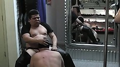 Chubby man-slut gets down to blow a leather daddy in a dungeon