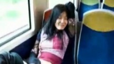 Asian milf masturbates pussy in the train